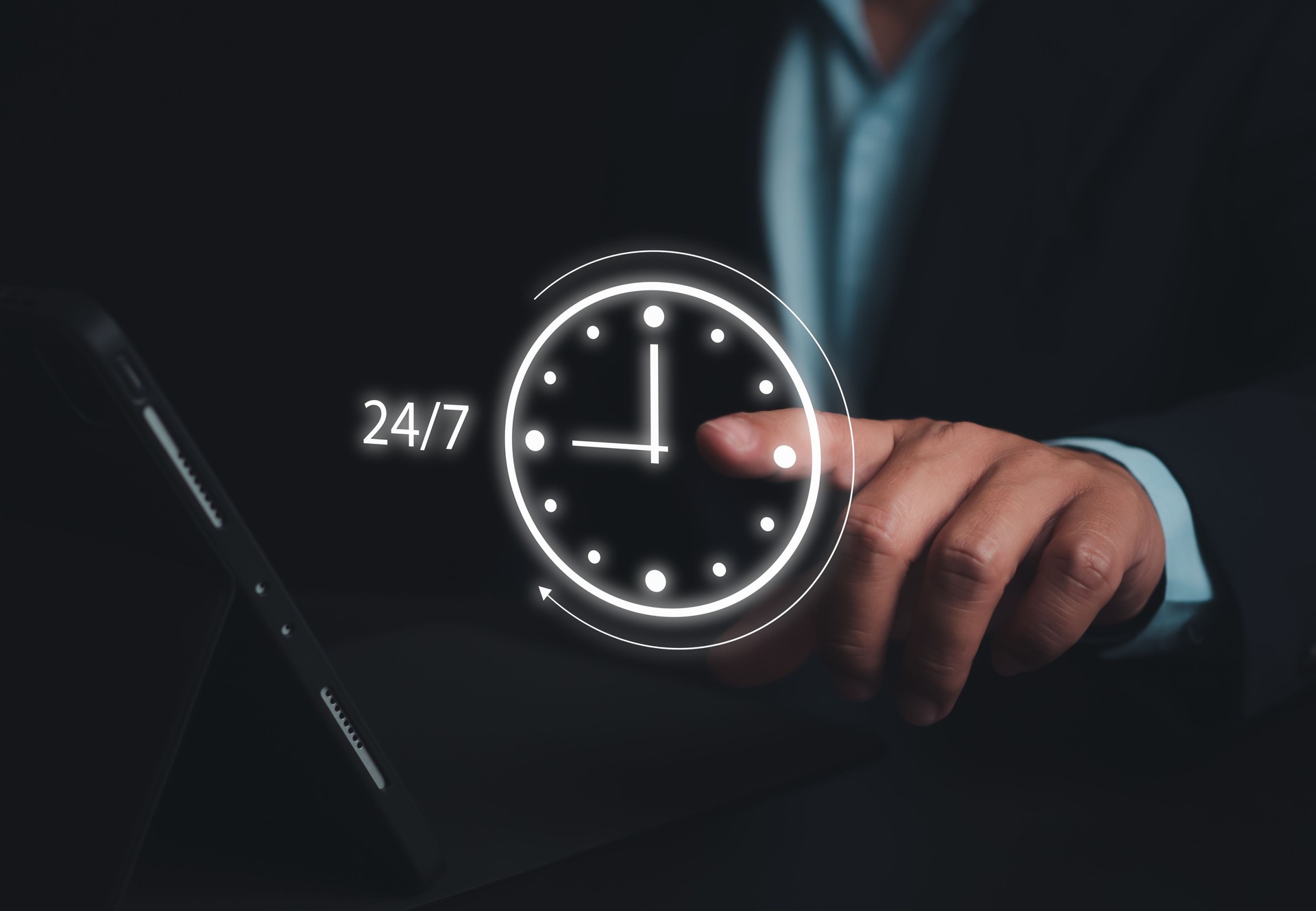 Businessman showing a symbol work 24 hour and 7 day by icon virtual screen hologram, 24 hour open, 24 hour payment online banking, shopping, transaction online service server cloud running.